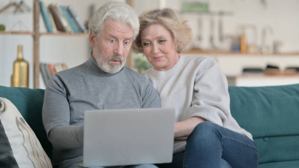 istock Couple Using on Laptop at Home 1347093028