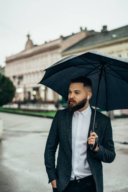 90+ Umbrella Salesman In The Rain Stock Photos, Pictures & Royalty-Free ...