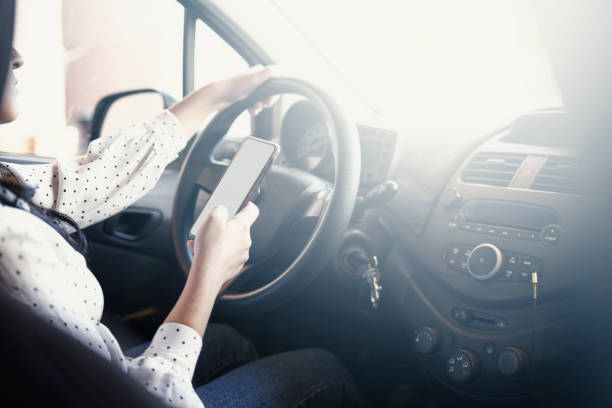 istock A person driving and texting 1347098710