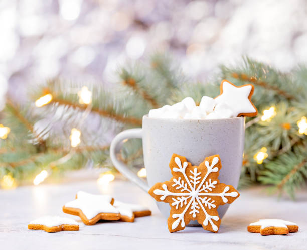 istock Cute Gingerbread snowflake Cookie in front of Hot cocoa with Marshmallows. 1347099472