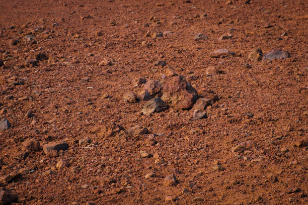 istock red sand and volcanic stones, Canary Island soil closeup - 1347100933