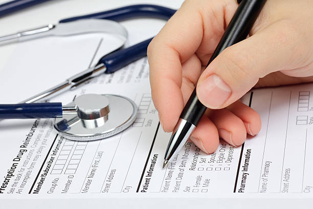 istock Person filling out patient information 134710299