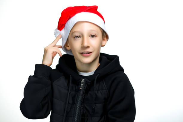 istock a boy in a Santa hat on a white background 1347103186