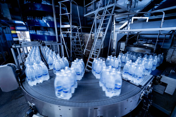 istock Modern strapping and transporting machine for packaging line at beverage plant. 1347104146