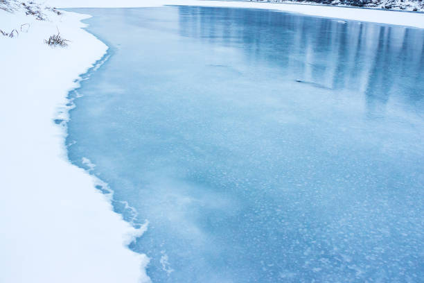 frozen river covered with ice stock photo