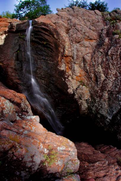 istock Scenic Waterfall In the Mountains 1347105382