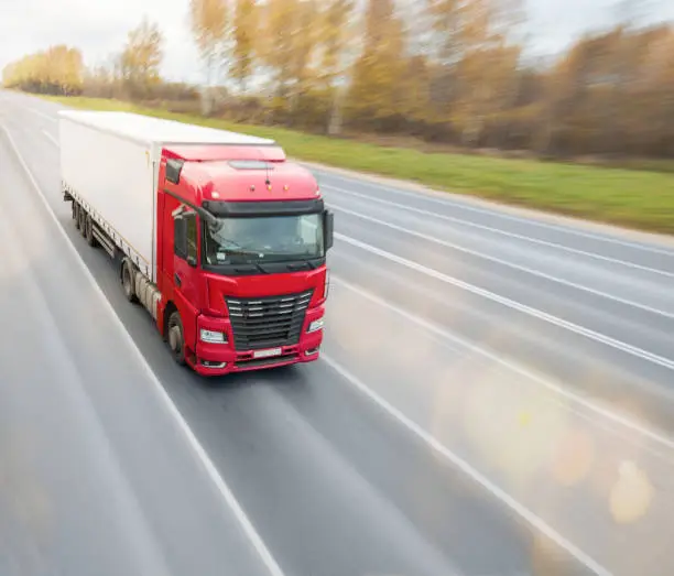 Photo of Heavy truck driving on the highway