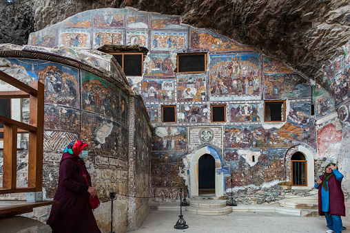 Istanbul,Turkey-October 15,2021:Sumela Monastery Courtyard In Trabzon.The Sümela Monastery  stands at the foot of a steep cliff facing the Altındere valley in the region of Maçka in Trabzon Province, Turkey. It is a major tourist attraction located in the Altındere National Park. It lies at an altitude of about 1200 metres overlooking much of the alpine scenery below.