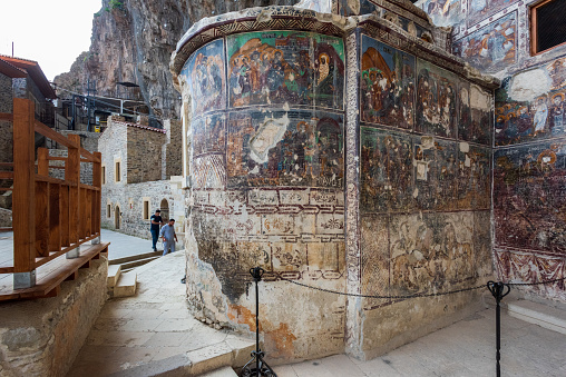 Istanbul,Turkey-October 15,2021:Sumela Monastery Courtyard In Trabzon.The Sümela Monastery  stands at the foot of a steep cliff facing the Altındere valley in the region of Maçka in Trabzon Province, Turkey. It is a major tourist attraction located in the Altındere National Park. It lies at an altitude of about 1200 metres overlooking much of the alpine scenery below.