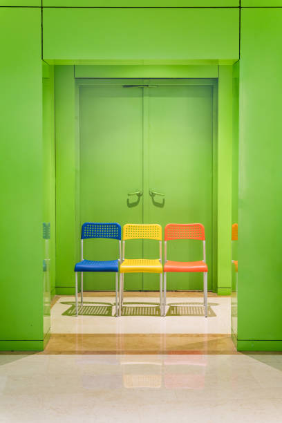 istock green colored interior with multiple colored chair in contrast. 1347107993