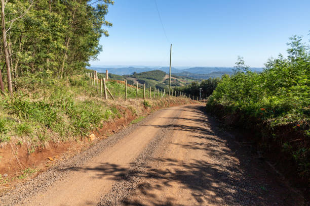 istock Dirty road with forest, mountains and valley 1347112168