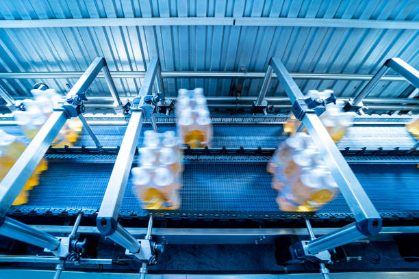 istock Modern strapping and transporting machine for packaging line at beverage plant. 1347113992