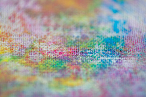 Extreme close-up of a fabric colored with special paint for backgrounds and graphic design.