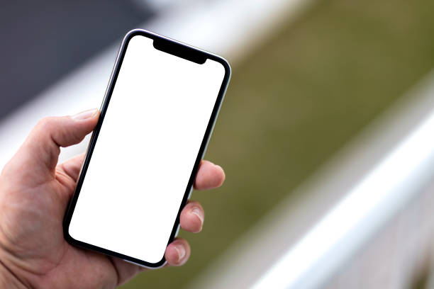 istock Man Holding Mobile Phone 1347118645