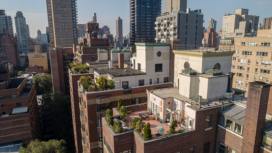 Green roof with a garden and patio on a rooftop of a residential building in Upper East Side, Manhattan, New York City, USA.