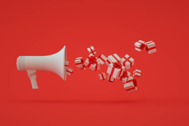 istock Megaphone with gift boxes, Christmas, new year red background 1347123943