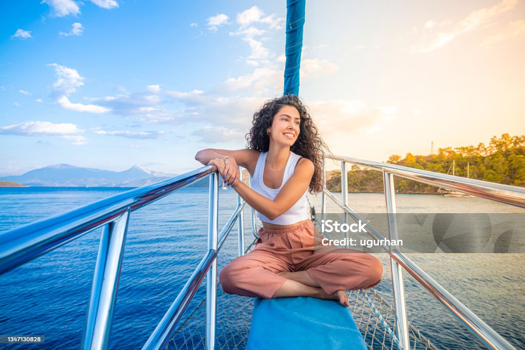 A girl standing at the bow yacht. Vacations Stock Photo