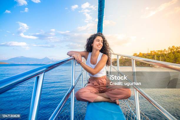 A Girl Standing At The Bow Yacht Stock Photo - Download Image Now - Vacations, Tropical Climate, Yacht