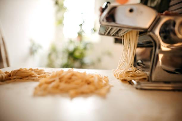 istock Young woman making homemade pasta in the kitchen 1347130955