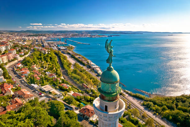 Trieste lighthouse Phare de la Victoire and cityscape panoramic aerial view Trieste lighthouse Phare de la Victoire and cityscape panoramic aerial view, Friuli Venezia Giulia region of Italy trieste stock pictures, royalty-free photos & images