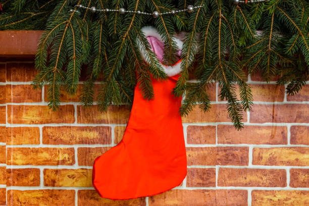 istock Branches of the fir tree and christmas stocking 1347136034