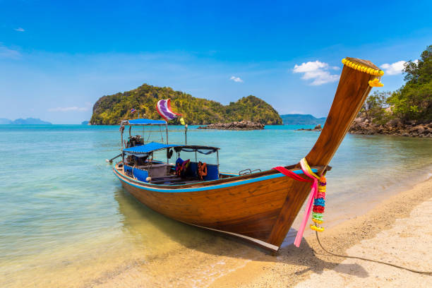 Thai traditional longtail boat Thai traditional wooden longtail boat at tropical beach in Thailand koh tao thailand stock pictures, royalty-free photos & images