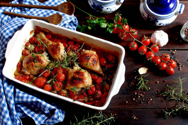 baked chicken with cherry tomatoes and garlic. top view - dinner croatia bildbanksfoton och bilder
