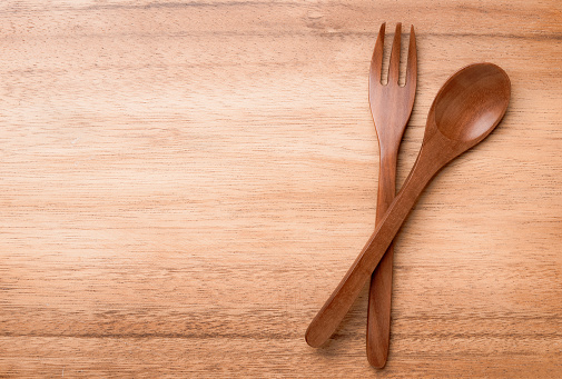 Wood spoon and fork on wooden boards