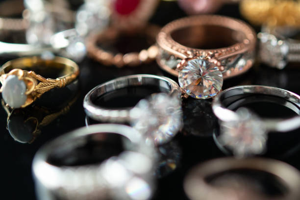 istock Beautiful diamond rings jewelry background 1347145547