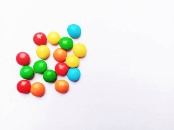 istock colored balls of chocolate candy on a white background 1347149527