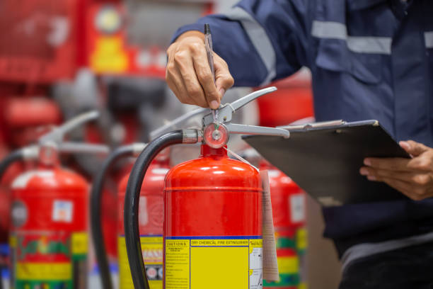 istock Engineer are checking and inspection a fire extinguishers tank in the fire control room for safety training and fire prevention. 1347150262