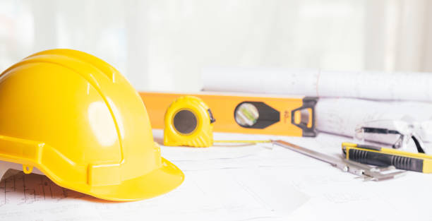 istock Work safety. Standard Construction site protective equipment on table wooden background, flat lay, copy space,safety first concepts. 1347150417
