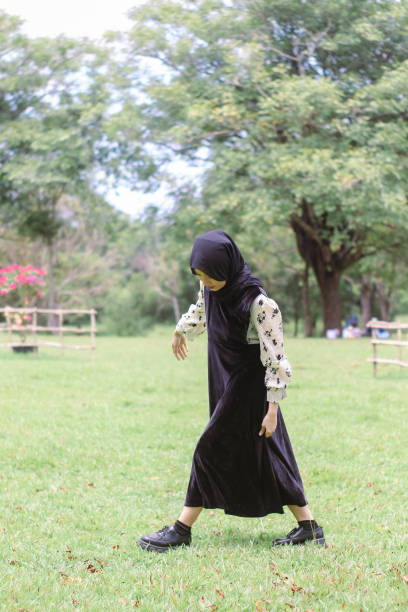 istock Young Hijab women walking enjoying at park 1347151101