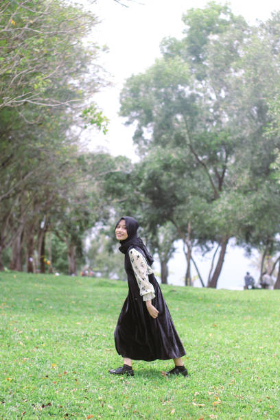 istock Young Hijab women walking enjoying at park 1347154418
