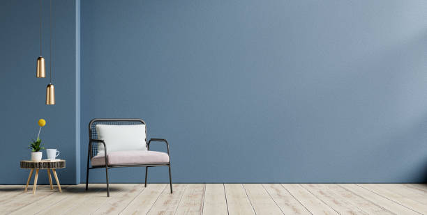 istock Living room with an armchair on empty dark blue wall background. 1347158034