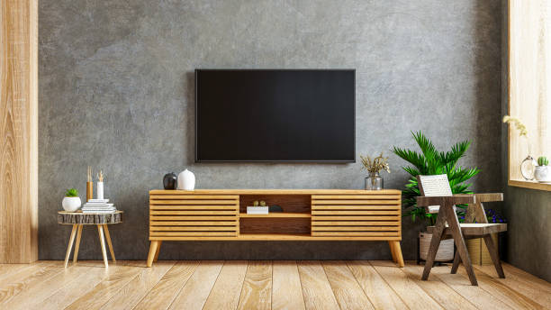 istock Loft empty room with tv and cabinet on dark concrete interior background. 1347158045
