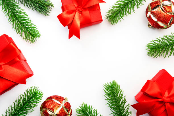 istock White Christmas and New Year background with red gift boxes, Christmas balls, spruce branches. Top view frame with copy space 1347159076