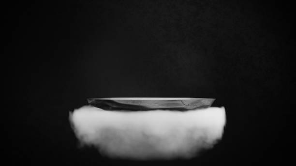 istock Dark stone podium floating on white fluffy cloud in empty space.Dark futuristic abstract background.3D rendering illustration. 1347160473