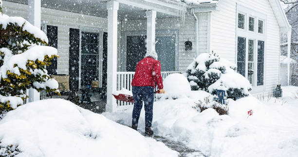 istock Red Jacket Woman Lifting Winter Blizzard Snow 1347161211