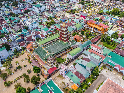 Aerial view of ancient Phuoc Hue pagoda on summer's day in Bao Loc, Vietnam, peaceful small town located on the plateau Di Linh, Lam Dong province. Travel and religion concept.