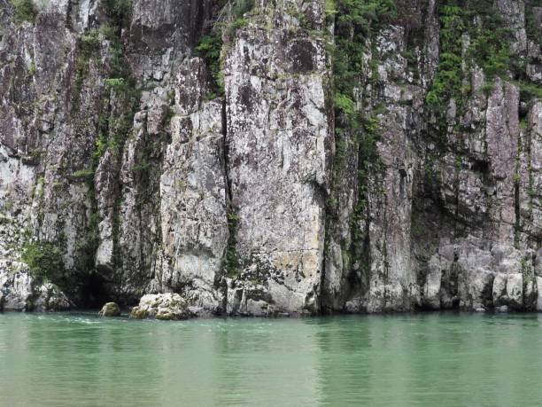 istock View of beautiful valley with green river water and steep cliffs 1347162815
