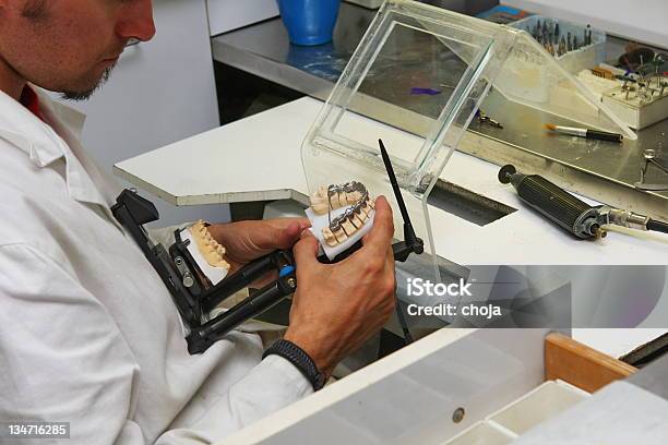 Manufacturing Of Dental Prosthesisyoung Man Dental Technician At Work Stock Photo - Download Image Now