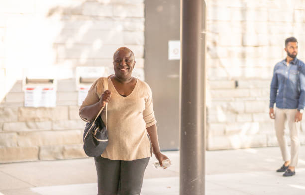 istock Senior Woman Entering a Community Center 1347163572