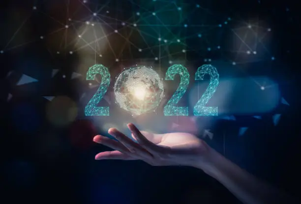 2022 and new beginning concept, hand show icon global network line, growth plan for business.