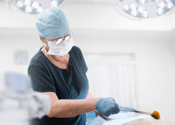 istock Nurse disinfecting patient in operating room 1347166088