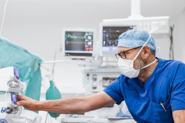 Free Stock Photo of Medical Professional in Scrubs and Mask Operating ...