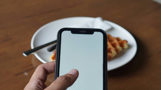 istock Mockup holding Smartphone with food in front 1347166992