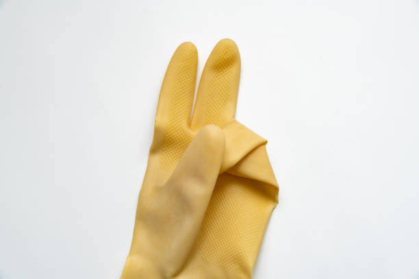istock Yellow rubber gloves on white background 1347168935