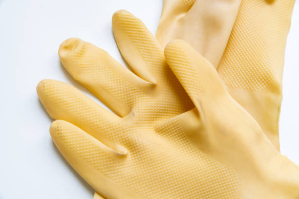 istock Yellow rubber gloves on white background 1347169004