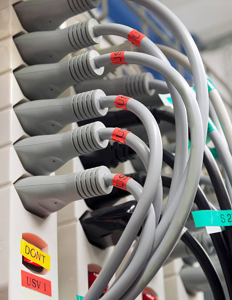 istock Many power cables coming out of a power outlet socket 134717099